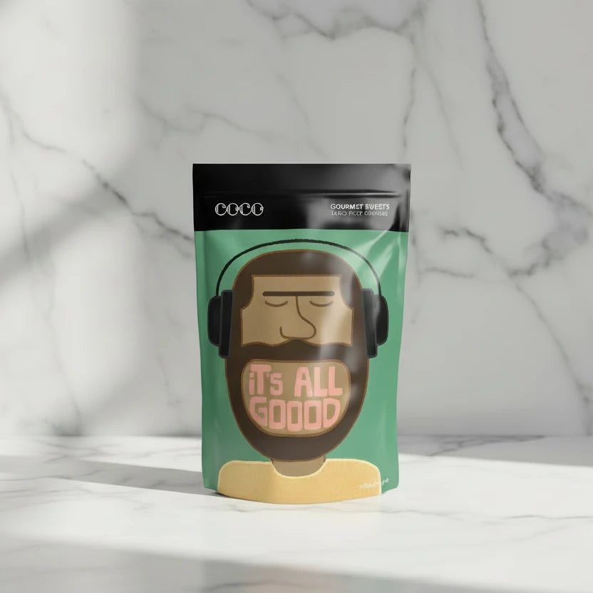 Candy package with a cartoon face and 'it's all good' text on a pink background