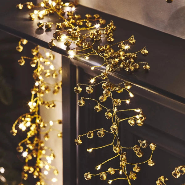 Decorative string lights on a dark surface with a blurred background