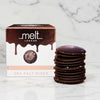 Dark chocolate sea salt discs with packaging labeled 'melt London' on a white background