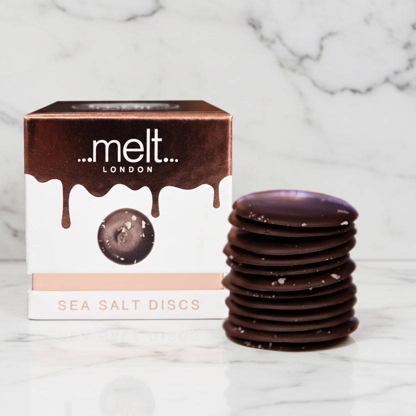 Dark chocolate sea salt discs with packaging labeled 'melt London' on a white background