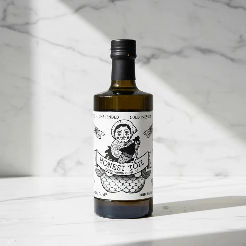 Bottle of Honest Oil olive oil with a label on a white background