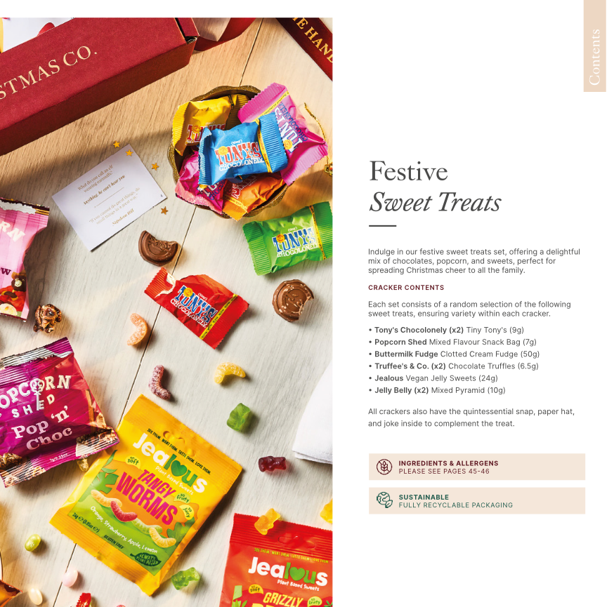 Festive sweet treats packaging with various colorful candy bars on a wooden surface.
