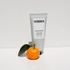 Tube of Verden hand cream with an orange and leaf on a white background