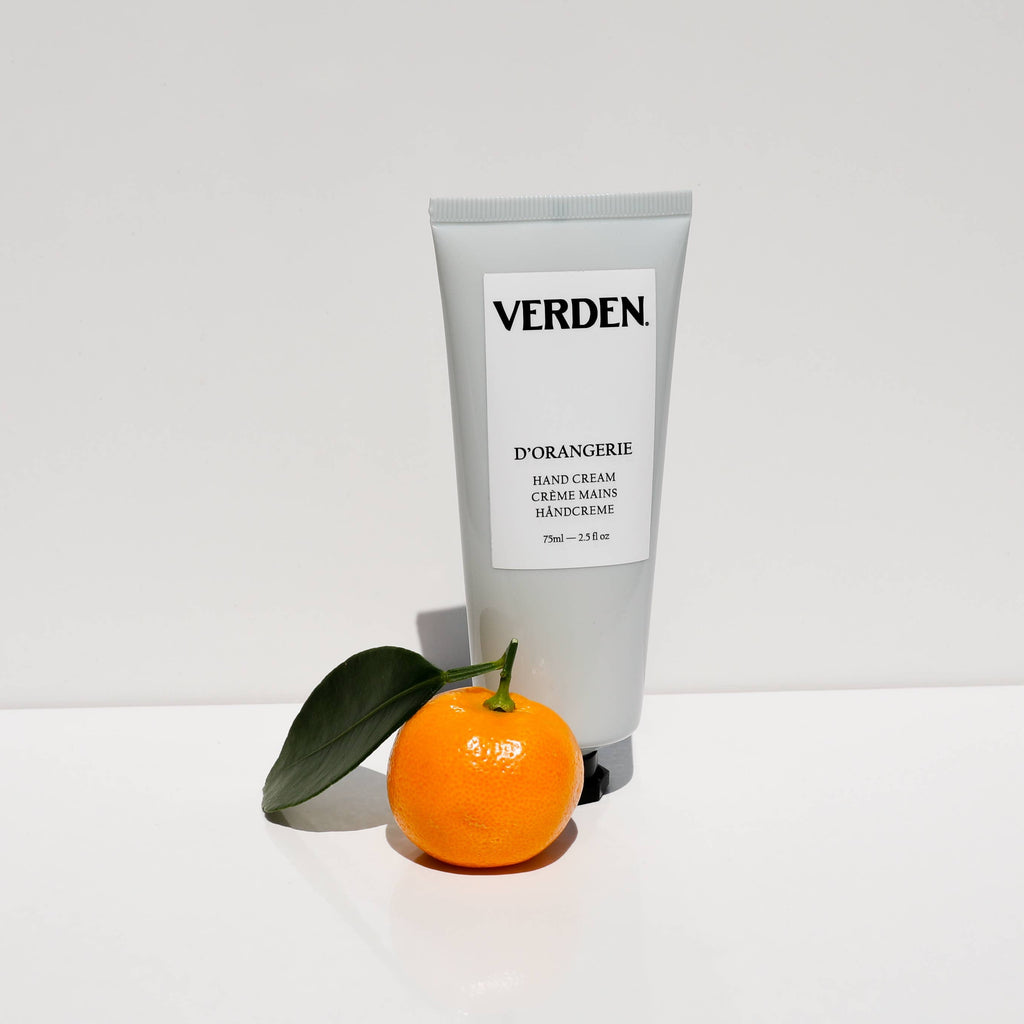 Tube of Verden hand cream with an orange and leaf on a white background