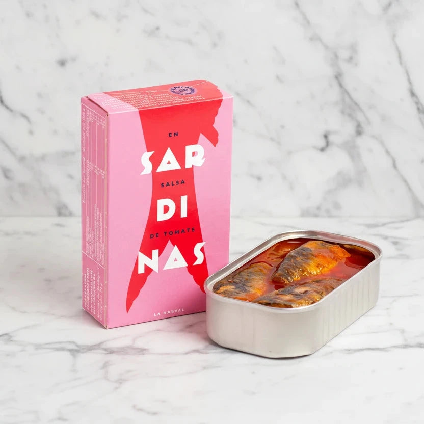 Sardine can and pink box with 'Sardinas' branding on a white background