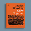 The front cover of the book 'Grow Together' by Charles Dowding, published by DK. The cover features a vibrant orange background with black and white typography and a black-and-orange illustration of a garden plot.