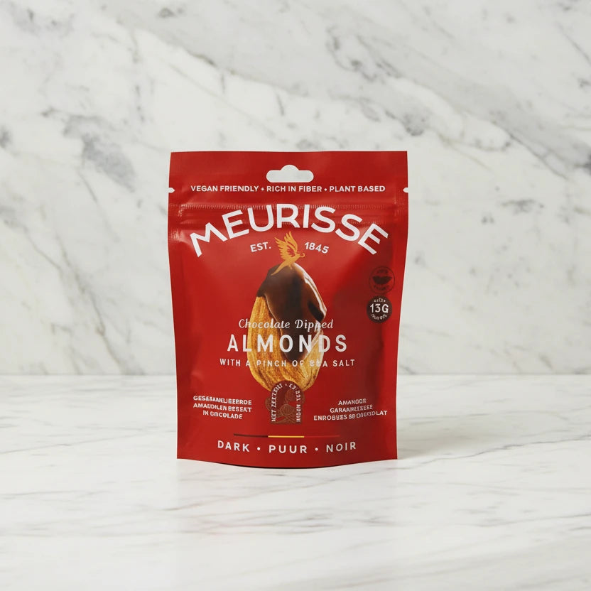 Red package of Meurisse almonds on a beige background