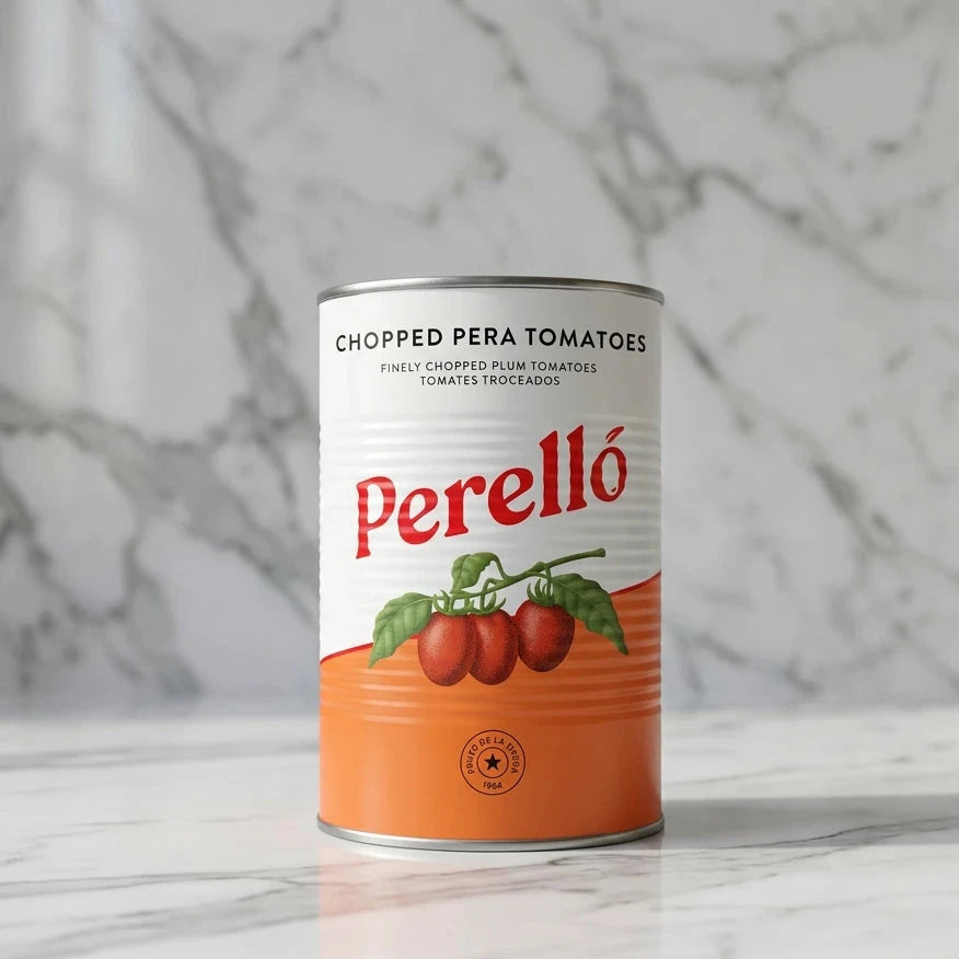 A can of Perelló Chopped Pera Tomatoes on a clean white background. The can features a white top half with black text and a red Perelló logo, and a bright orange bottom half with an illustration of three red tomatoes on the vine.