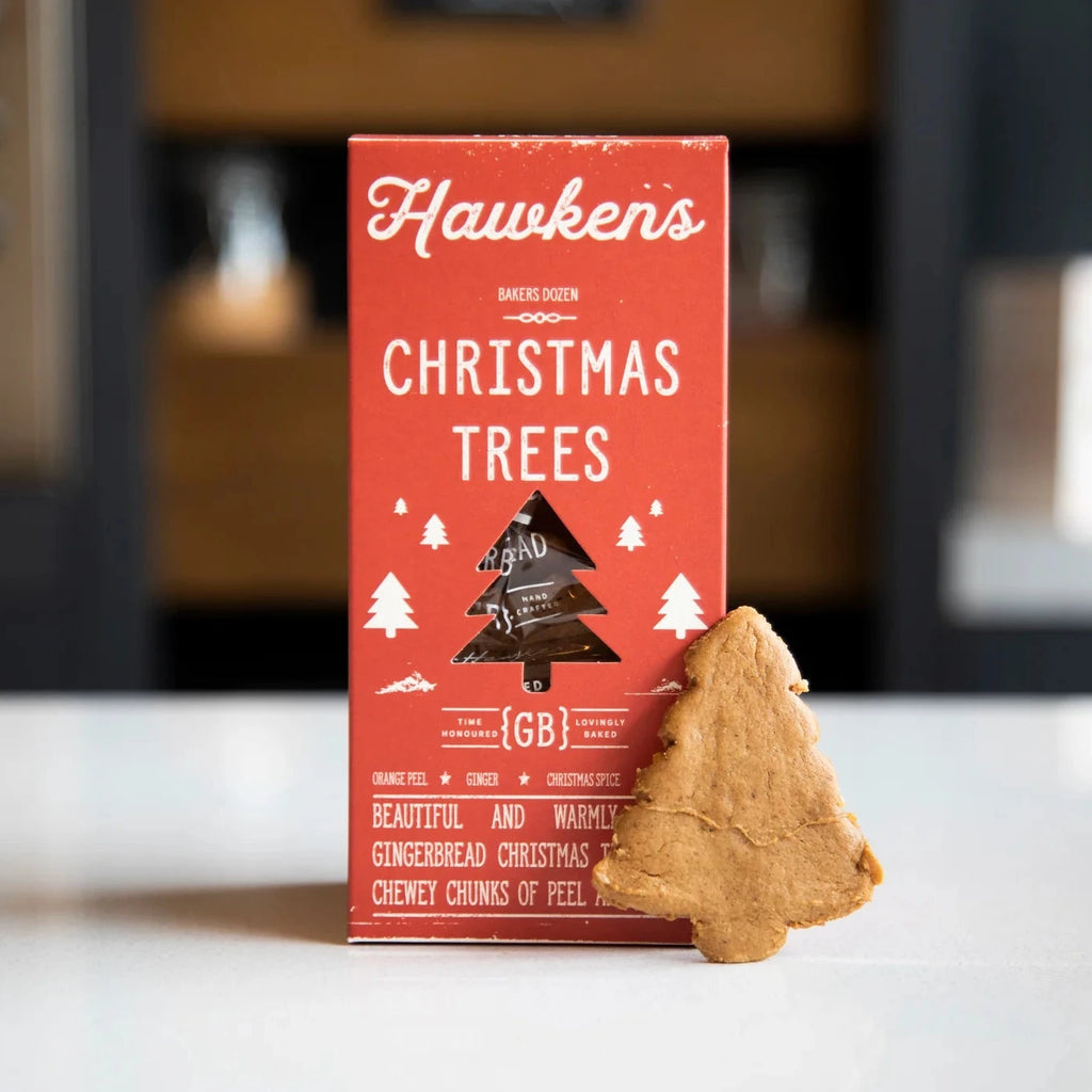 Red box labeled 'Hawken's Christmas Trees' with a tree-shaped cookie on a white surface.