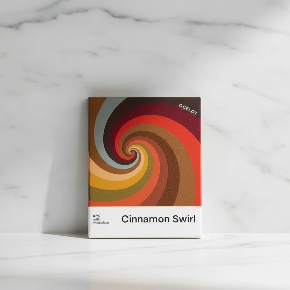 Ocelot Cinnamon Swirl chocolate packaging with colorful spiral design on a white background