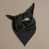 Dark gray triangular scarf on a beige background