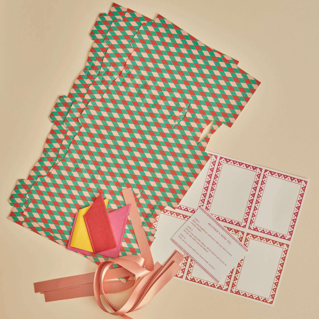 Checkered paper, ribbons, and cards on a beige background