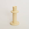 Beige candle holder on a light beige background
