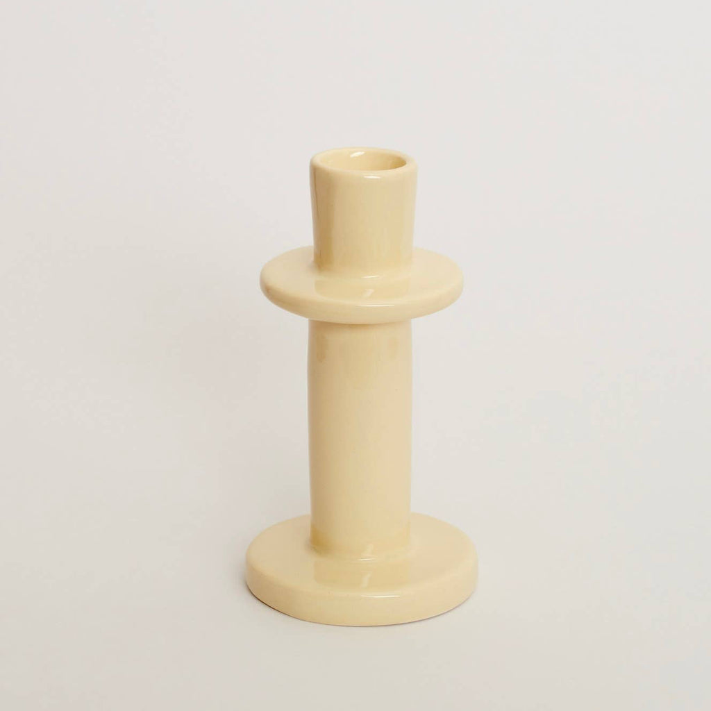 Beige candle holder on a light beige background