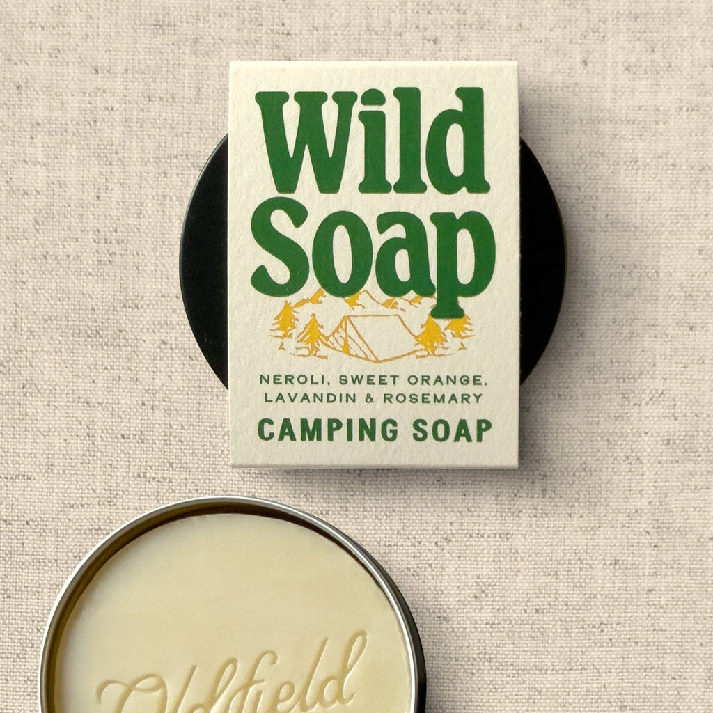 Wild Soap packaging with a camping theme on a textured beige background