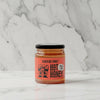 Jar of Black Bee Honey Hot Honey on a light background