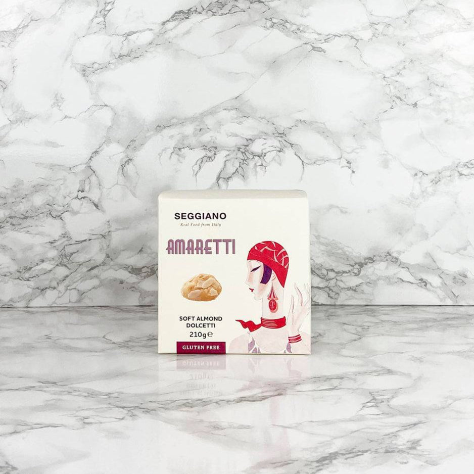 A package of Seggiano Soft Amaretti Biscuits on a marble background.